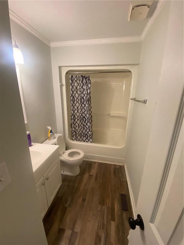 120 Coachman Dr, Anderson, SC 29625 - bathroom with ornamental molding, toilet, vanity, wood finished floors, and shower / bath combo