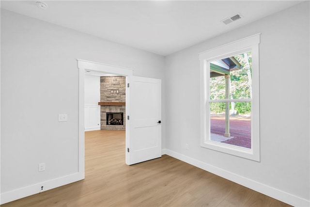 104 Hart Rd, Anderson, SC 29621 - spare room featuring light wood-style flooring, baseboards, and a fireplace