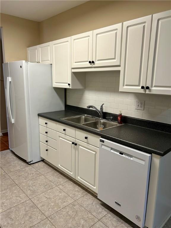 105 Eagle Ct, Westminster, SC 29693 - kitchen with white appliances, a sink, white cabinets, and tasteful backsplash