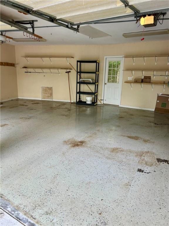 105 Eagle Ct, Westminster, SC 29693 - garage featuring a garage door opener and baseboards