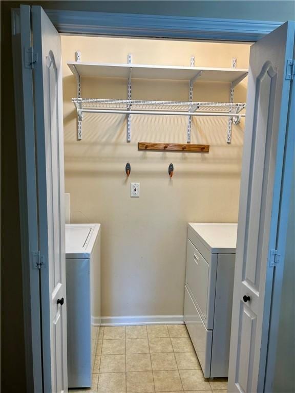 105 Eagle Ct, Westminster, SC 29693 - washroom with light tile patterned floors, baseboards, and washing machine and dryer