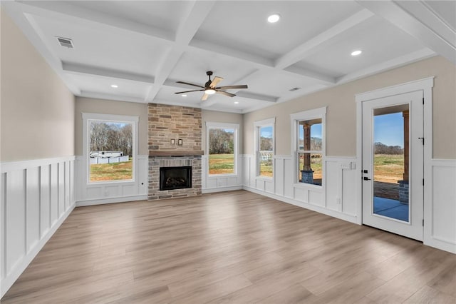 1621 Old Dobbins Bridge Rd, Townville, SC 29689 - unfurnished living room with coffered ceiling, a ceiling fan, light wood-style floors, beamed ceiling, and a wainscoted wall