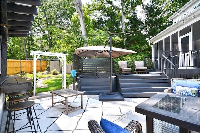 203 Tulip Tree Ct, Easley, SC 29642 - fenced backyard with a hot tub, a sunroom, a patio, an outdoor fire pit, and view of scattered trees