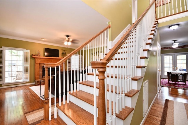 203 Tulip Tree Ct, Easley, SC 29642 - staircase featuring ceiling fan, hardwood / wood-style flooring, crown molding, and baseboards