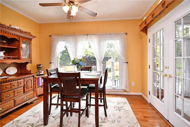 203 Tulip Tree Ct, Easley, SC 29642 - dining space with healthy amount of natural light, crown molding, a ceiling fan, and light wood finished floors
