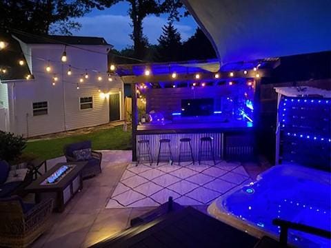 203 Tulip Tree Ct, Easley, SC 29642 - patio at night with an outdoor fire pit and a patio