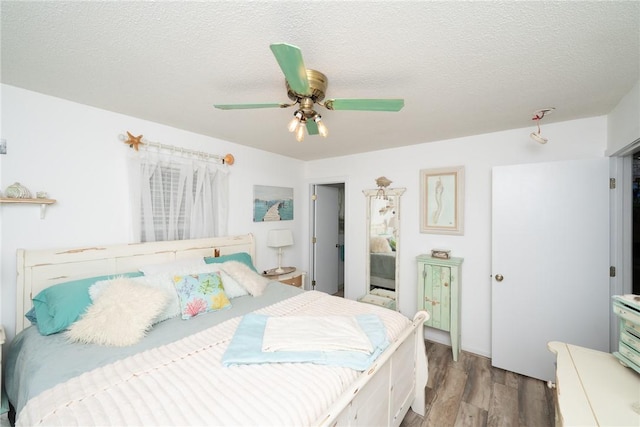 79 Blue Heron Cv, Abbeville, SC 29620 - bedroom featuring light wood-style flooring, a textured ceiling, and a ceiling fan