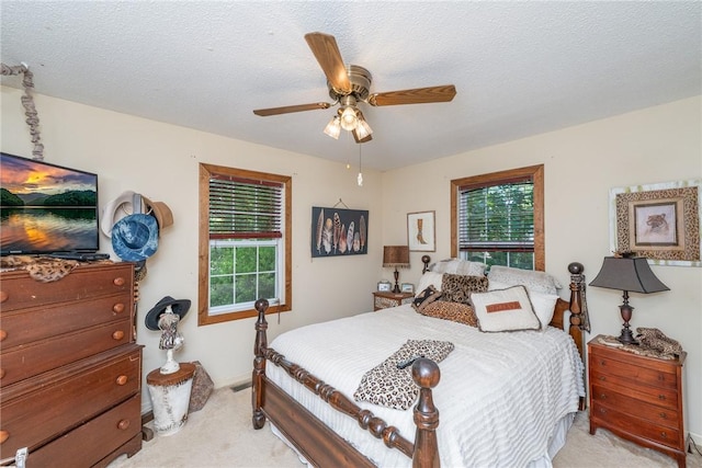 79 Blue Heron Cv, Abbeville, SC 29620 - bedroom with light colored carpet, multiple windows, a ceiling fan, and a textured ceiling