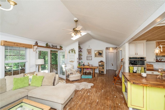 79 Blue Heron Cv, Abbeville, SC 29620 - living area with vaulted ceiling, a textured ceiling, wood finished floors, and a ceiling fan