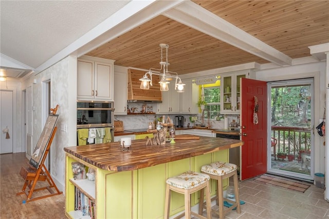 79 Blue Heron Cv, Abbeville, SC 29620 - kitchen with wood counters, open shelves, stainless steel double oven, glass insert cabinets, and a kitchen island