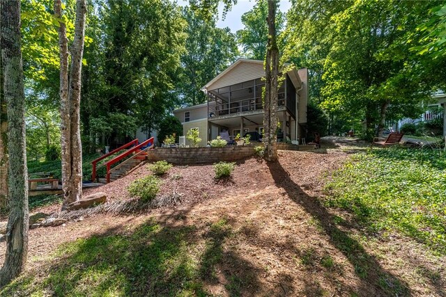 79 Blue Heron Cv, Abbeville, SC 29620 - back of house with stairs and a sunroom