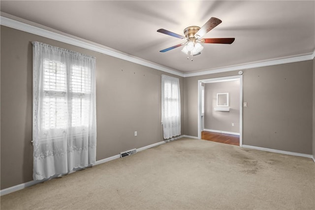 2909 Olive St, Anderson, SC 29625 - carpeted empty room with healthy amount of natural light, crown molding, and ceiling fan