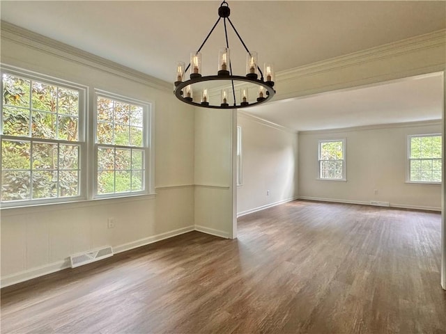 102 Buckingham Ct, Easley, SC 29640 - empty room with wood finished floors, a chandelier, ornamental molding, and baseboards