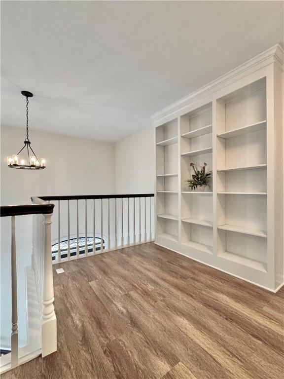 102 Buckingham Ct, Easley, SC 29640 - spare room featuring a chandelier and wood finished floors