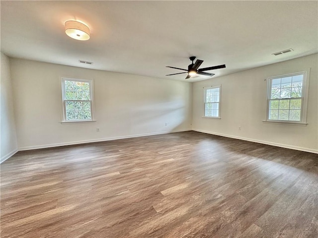 102 Buckingham Ct, Easley, SC 29640 - spare room with wood finished floors, ceiling fan, and baseboards