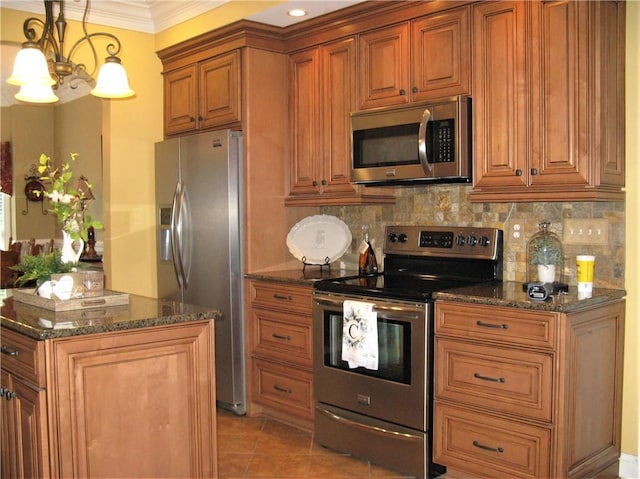 307 Holly Ridge Dr, Anderson, SC 29621 - kitchen with appliances with stainless steel finishes, brown cabinets, backsplash, crown molding, and dark stone countertops