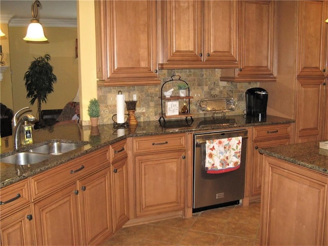 307 Holly Ridge Dr, Anderson, SC 29621 - kitchen featuring a sink, brown cabinetry, dark stone counters, tasteful backsplash, and crown molding