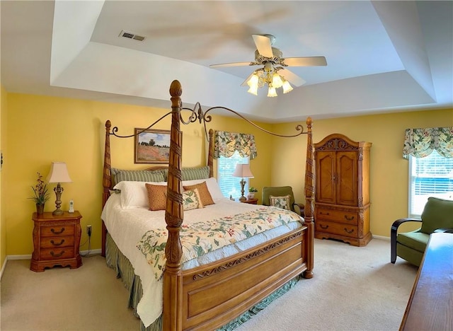 307 Holly Ridge Dr, Anderson, SC 29621 - bedroom with a tray ceiling, multiple windows, and light colored carpet