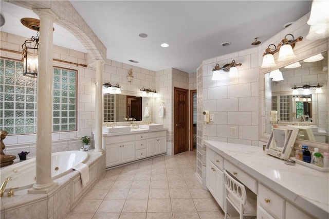 405 Windcrest Ct, Salem, SC 29676 - full bathroom featuring tile walls, decorative columns, tile patterned floors, a tub with jets, and two vanities