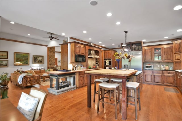 405 Windcrest Ct, Salem, SC 29676 - kitchen with stainless steel appliances, wall chimney exhaust hood, a ceiling fan, butcher block countertops, and recessed lighting