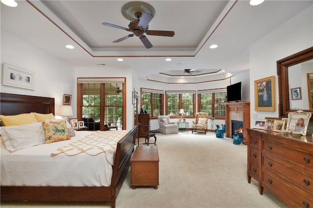 405 Windcrest Ct, Salem, SC 29676 - carpeted bedroom with a tray ceiling, multiple windows, a lit fireplace, and recessed lighting