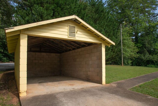 200 Bulwinkle Dr, Walhalla, SC 29691 - view of outbuilding with a detached carport, driveway, and a wooded view