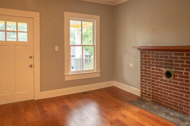200 Bulwinkle Dr, Walhalla, SC 29691 - unfurnished living room with wood finished floors, plenty of natural light, and crown molding