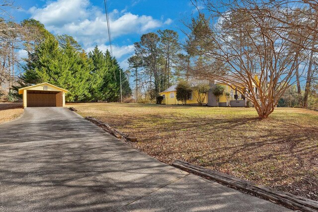 200 Bulwinkle Dr, Walhalla, SC 29691 - view of grassy yard with an outbuilding, a detached garage, and driveway