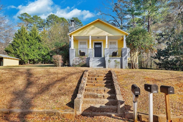 200 Bulwinkle Dr, Walhalla, SC 29691 - view of front of home with covered porch, a chimney, stairway, and brick siding