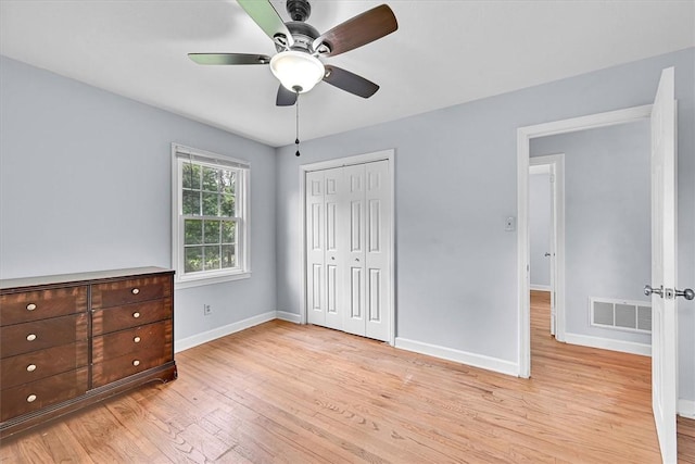 440 Cooley Bridge Rd, Pelzer, SC 29669 - unfurnished bedroom with light wood-style floors, a closet, and a ceiling fan