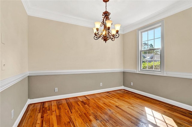 10 Laurelcrest Ln, Travelers Rest, SC 29690 - spare room with ornamental molding, a chandelier, and wood finished floors