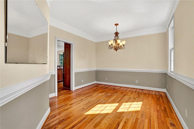 10 Laurelcrest Ln, Travelers Rest, SC 29690 - empty room with a chandelier, light wood-style floors, healthy amount of natural light, and crown molding