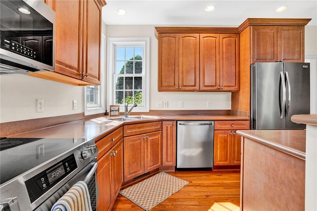 10 Laurelcrest Ln, Travelers Rest, SC 29690 - kitchen with appliances with stainless steel finishes, light wood finished floors, recessed lighting, and brown cabinetry