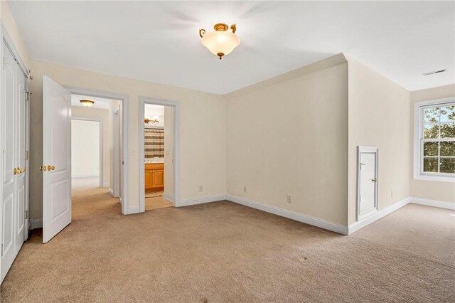 10 Laurelcrest Ln, Travelers Rest, SC 29690 - unfurnished bedroom featuring light carpet and ensuite bath