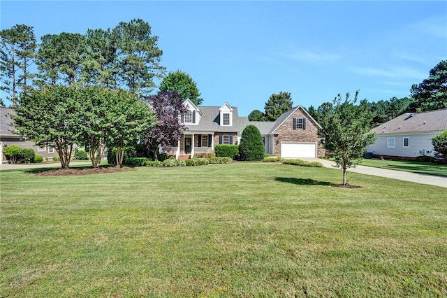10 Laurelcrest Ln, Travelers Rest, SC 29690 - view of front of home featuring driveway, a garage, a front yard, and stone siding