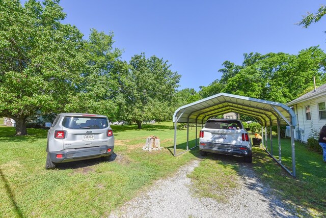 102 Langely St, Abbeville, SC 29620 - view of vehicle parking featuring driveway and a carport