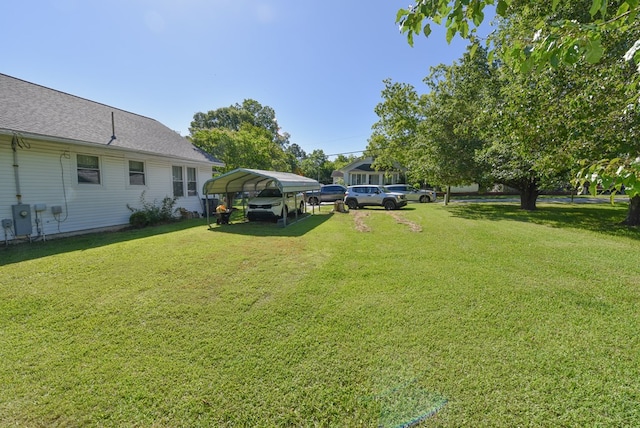 102 Langely St, Abbeville, SC 29620 - view of grassy yard with a carport