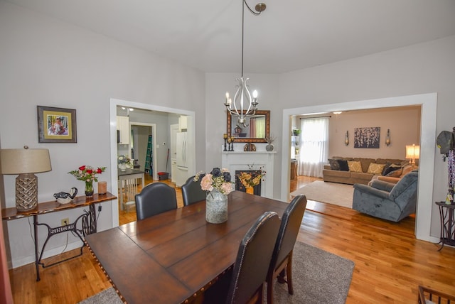 102 Langely St, Abbeville, SC 29620 - dining space featuring light wood finished floors and a chandelier