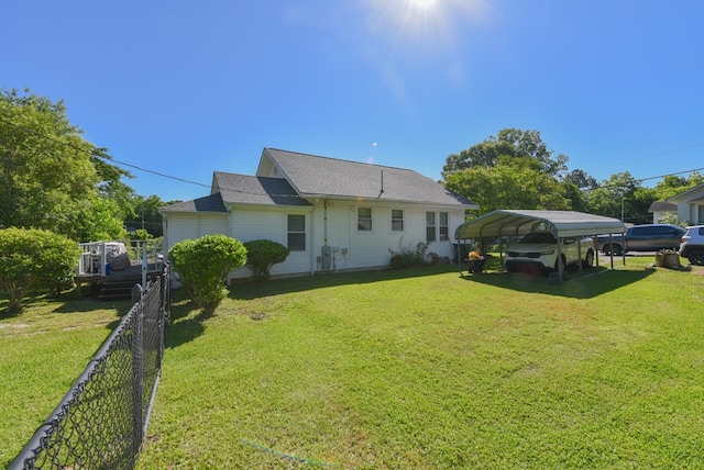 102 Langely St, Abbeville, SC 29620 - rear view of property featuring a detached carport and a shingled roof