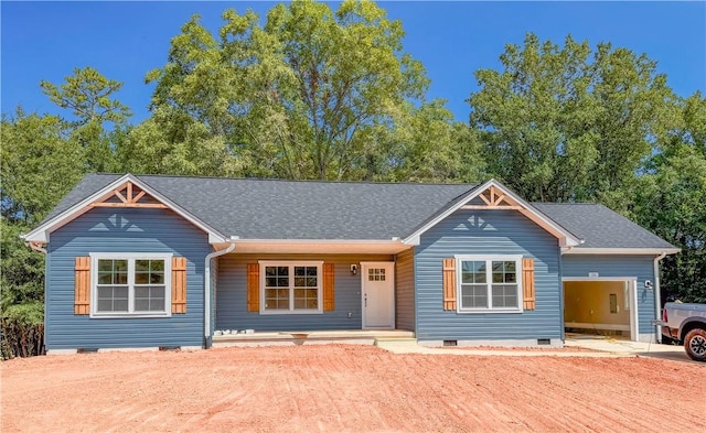 325 Code Cir, Seneca, SC 29678 - view of front facade featuring crawl space, roof with shingles, driveway, a garage, and covered porch
