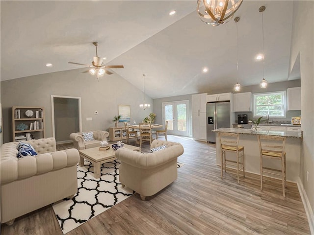 325 Code Cir, Seneca, SC 29678 - living room with vaulted ceiling, light wood-style floors, a chandelier, ceiling fan, and recessed lighting
