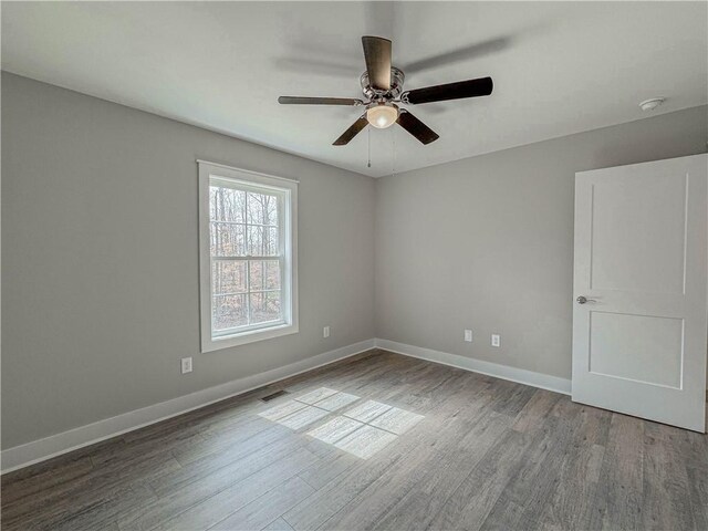 325 Code Cir, Seneca, SC 29678 - spare room with wood finished floors and a ceiling fan