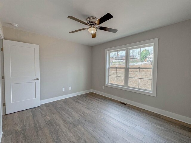 325 Code Cir, Seneca, SC 29678 - spare room with wood finished floors, ceiling fan, and a smoke detector
