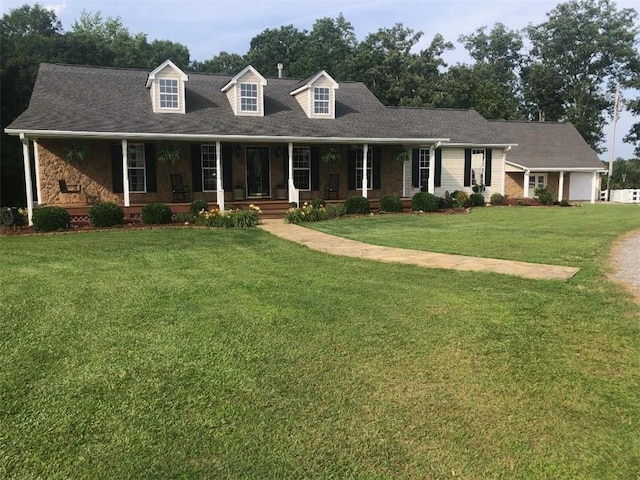 431 Seigler Rd, Iva, SC 29655 - new england style home featuring covered porch, a front yard, and an attached garage