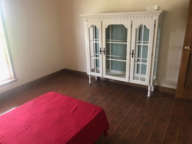 431 Seigler Rd, Iva, SC 29655 - unfurnished bedroom featuring dark wood-style floors and baseboards