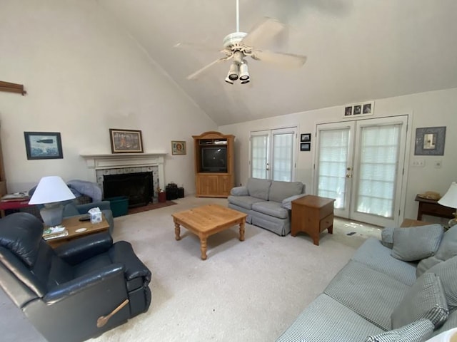 621 Chase Lndg, Martin, GA 30557 - carpeted living area with french doors, ceiling fan, a tiled fireplace, plenty of natural light, and high vaulted ceiling