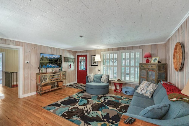 197 Jubie Ln, Seneca, SC 29672 - living room featuring ornamental molding, wood finished floors, and wood walls