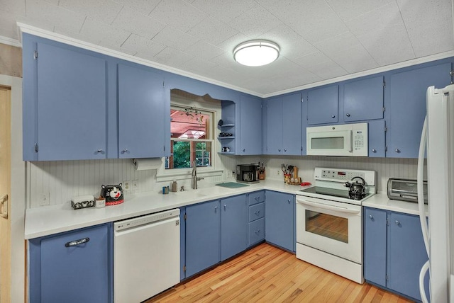 197 Jubie Ln, Seneca, SC 29672 - kitchen featuring white appliances, blue cabinetry, light wood finished floors, light countertops, and crown molding