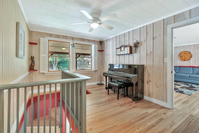 197 Jubie Ln, Seneca, SC 29672 - sitting room with ornamental molding, wood finished floors, ceiling fan, and wooden walls