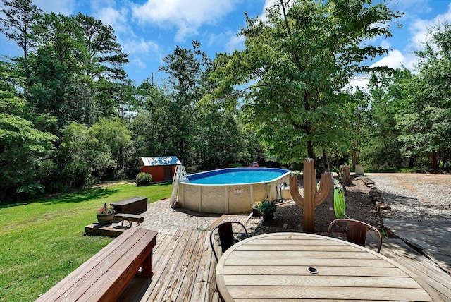 197 Jubie Ln, Seneca, SC 29672 - wooden terrace featuring a lawn, an outdoor pool, and a storage shed